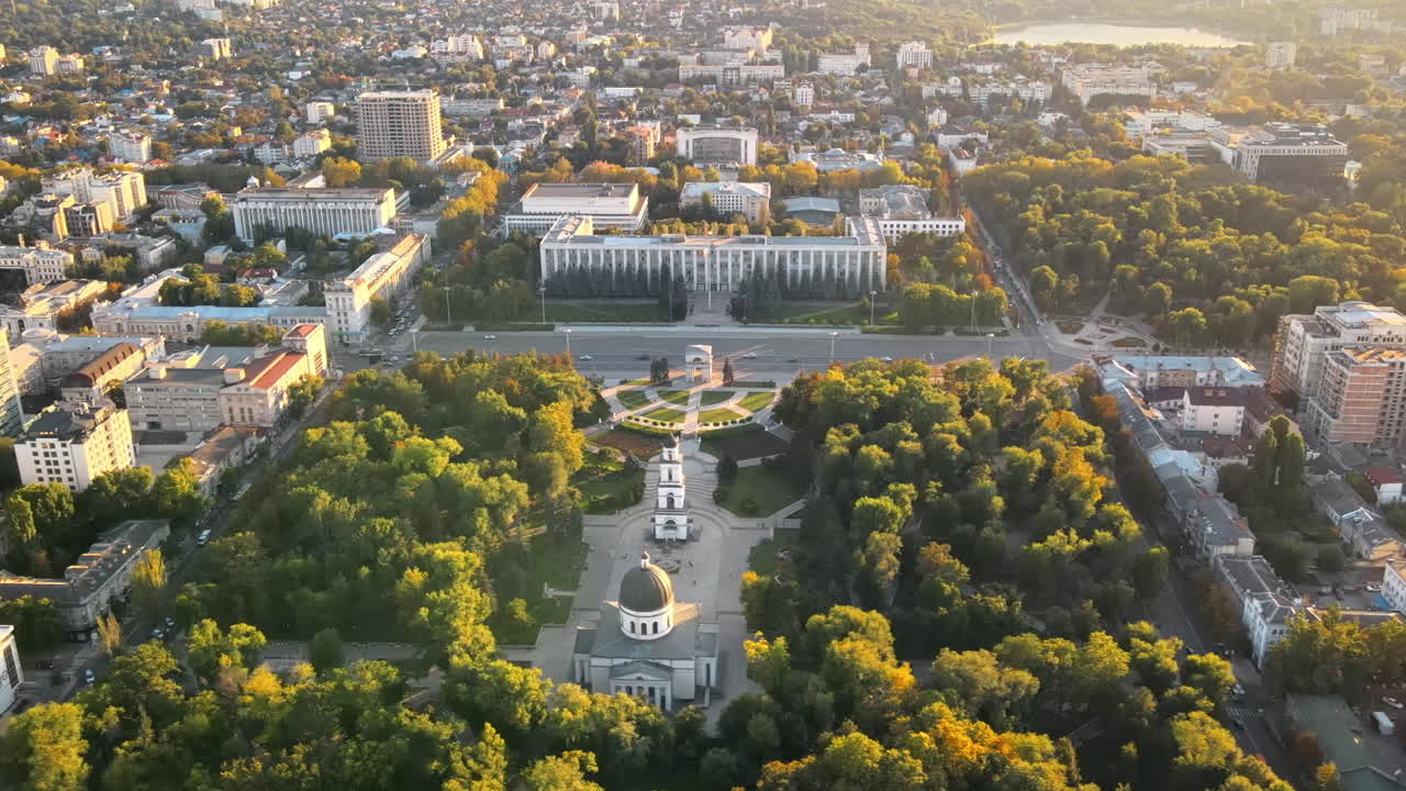Aerial drone view of Chisinau downtown at sunset. Panorama view of Central Park, Cathedral, Goverment a lot of greenery, buildings. Moldova
