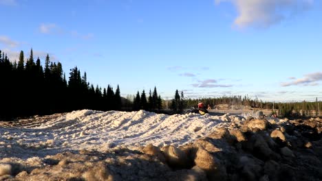 Two-snowmobiles-are-racing