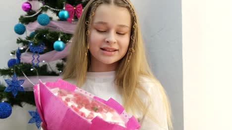 girl with christmas tree and flowers