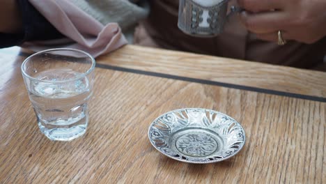 turkish coffee and water at a cafe