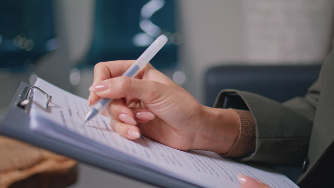 Clinic patient hands writing medical documents in modern office closeup