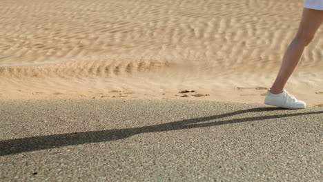 woman with white sneakers walking