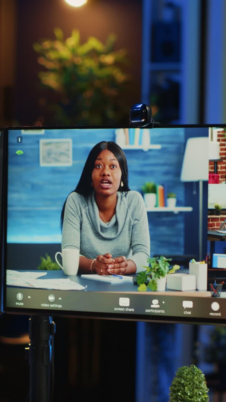 Software Developer on Video Call with Team Showing Code
