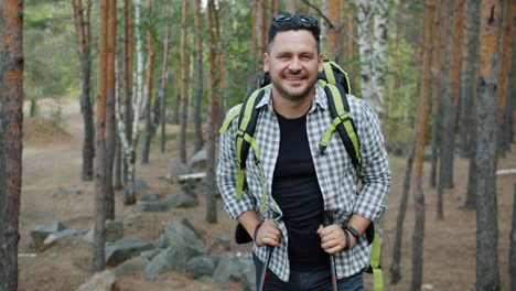smiling hiker in a forest