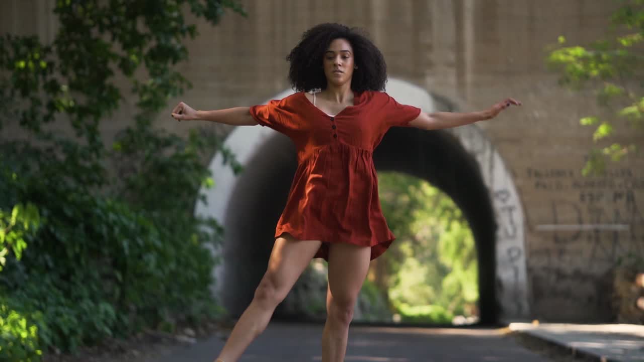 Handheld shot of a cuban urban ballerina dancing of the streets of havana