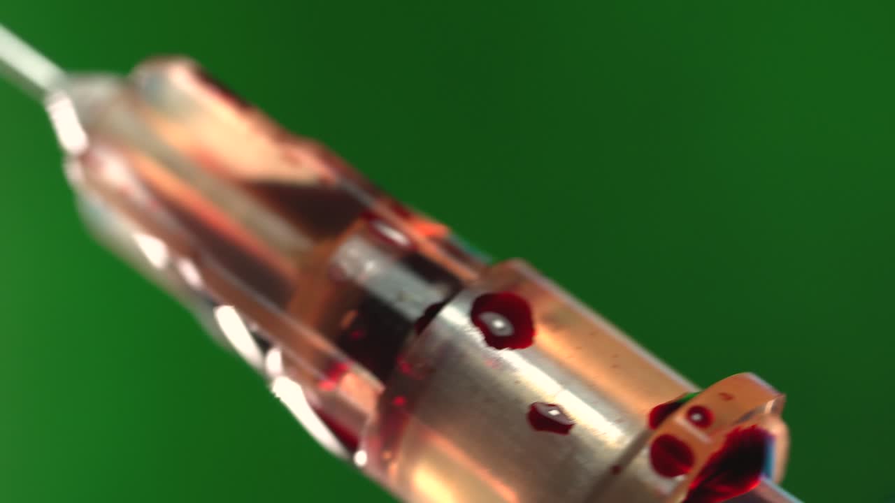 Close-up of a drop of blood on a needle