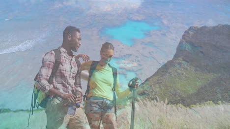 man and woman hikers tracking health data on coastal hillside, with camera, backpack icons