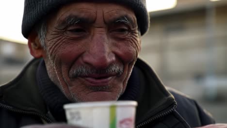 an intimate portrait of resilience: a weathered man's journey captured in two frames, reflecting moments of life, connection, and humanity's simple joys.