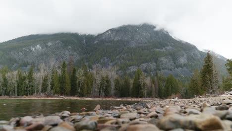 Pine-Forest,-Cloudy-Mountains,-Nearby-Stream-Waters,-Springtime-Afternoon-at-St