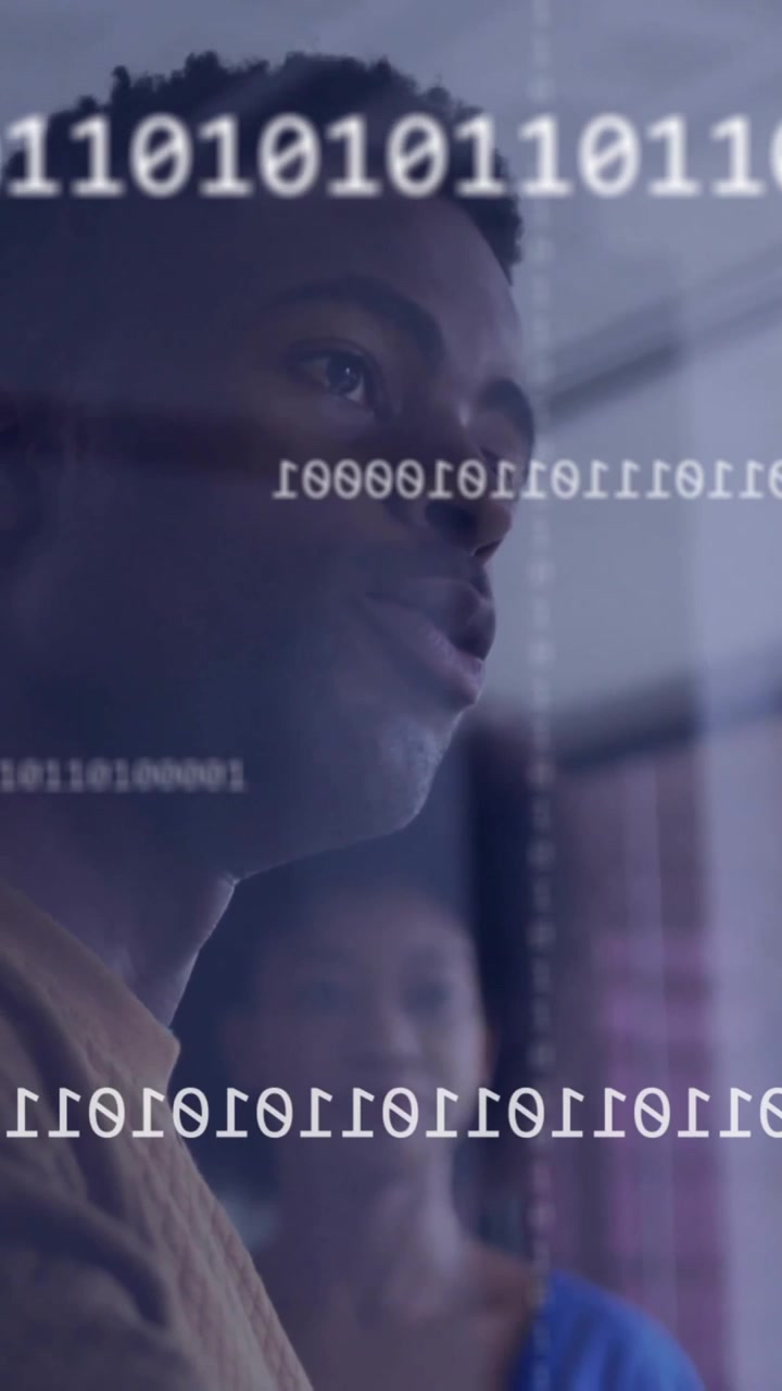 Animation of binary coding over diverse colleagues discussing work in office