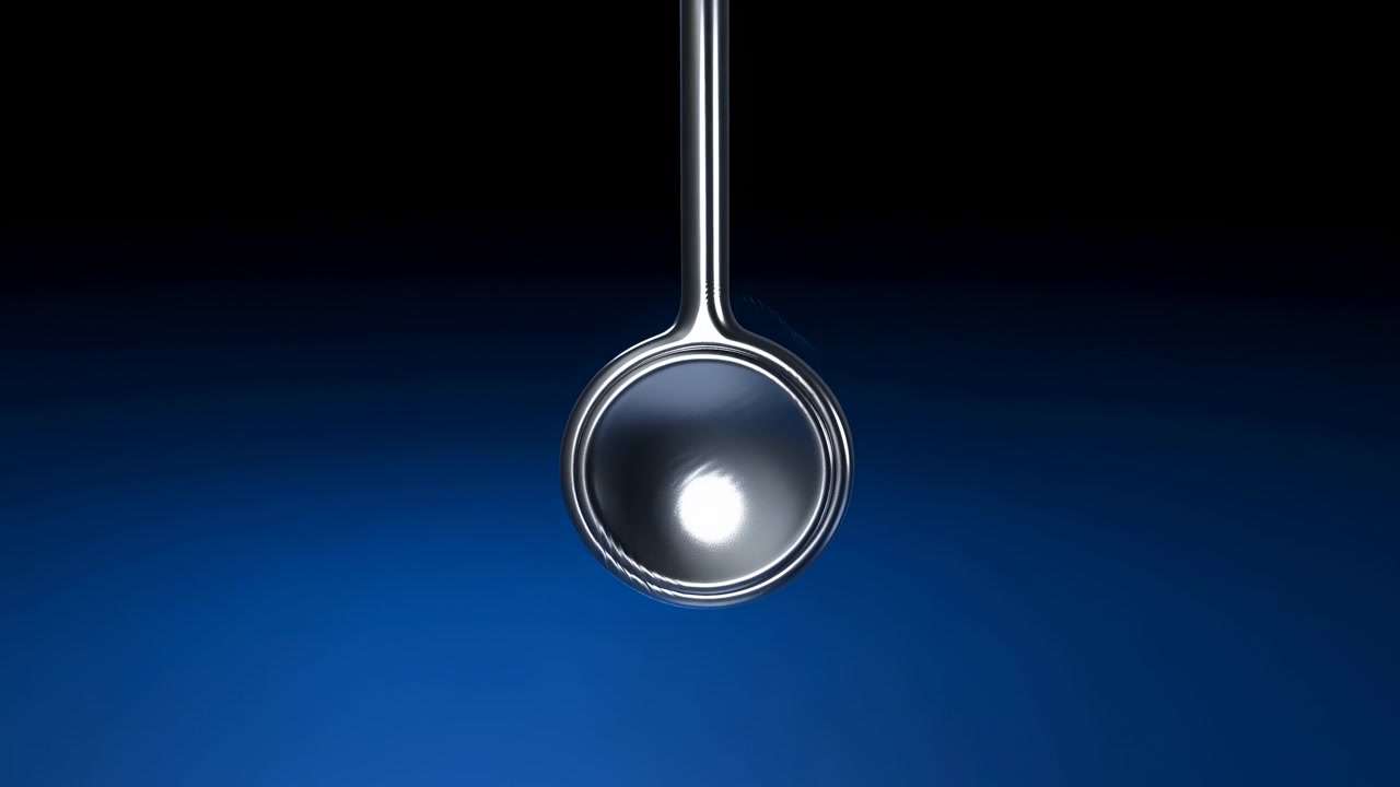 Spoon swinging, in dark background with blue gradient, with spoon, from a close-up side view perspective, with black, blue accents, and neutral mood, showing nearby objects and surrounding setting.
