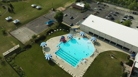 outdoor pool in american suburb, aerial orbit