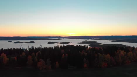 slow rising evening aerial shot of norwegian fjord showing bog boats and islands