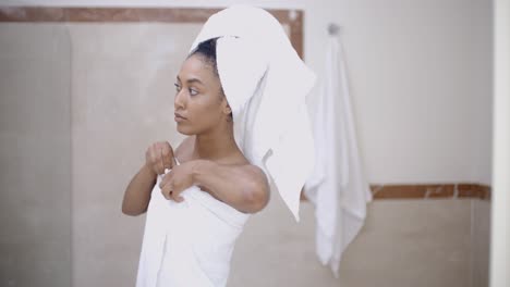 Woman-With-Towel-On-Head-In-The-Bathroom