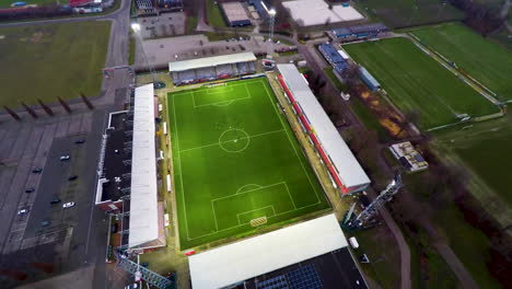 aerial tilt down of soccer field with football players