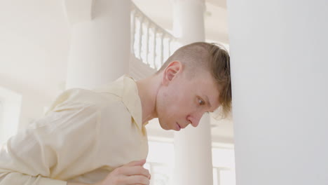 close up view of man dancer dancing leaning on a column in the studio