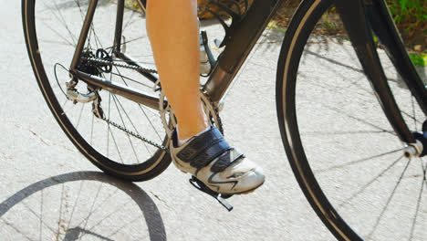 senior cyclist cycling on a road at countryside 4k