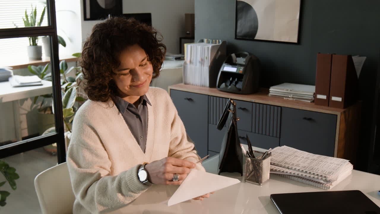 Woman reading documents in an office setting