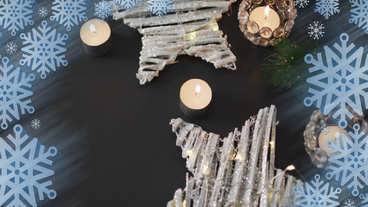 Animation of christmas decorations and tea candles over snowflakes on grey background