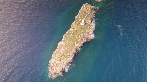 Aerial-tilt-down-view-of-Punta-de-El-Toro-limestone-rock-formation,-Mallorca