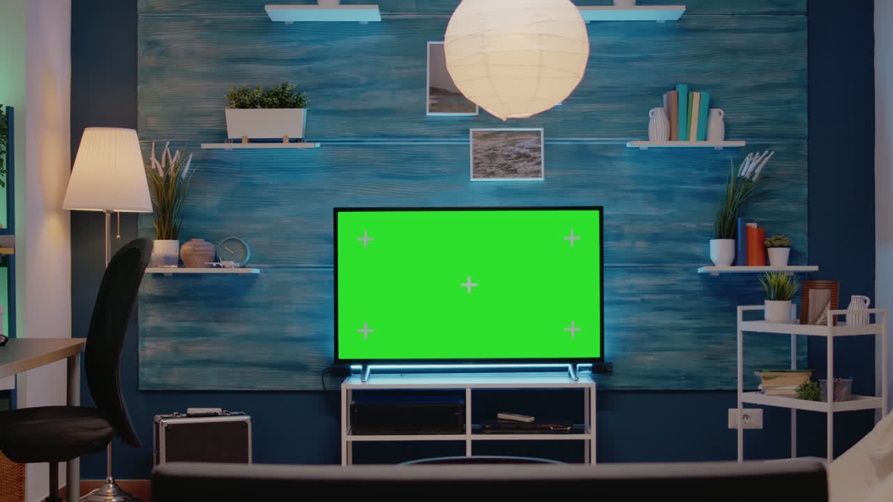 Green screen design on television in empty room