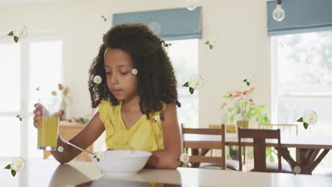 Animation-of-roses-over-african-american-girl-drinking-juice-and-eating-breakfast