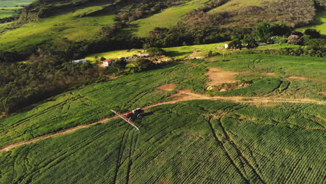 tractor spraying soybean plantation in brazil