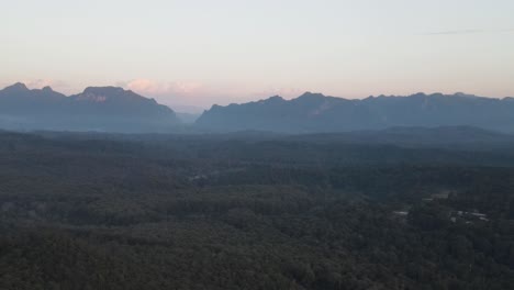 aerial view of morning fog over tropical forest in chiang dao