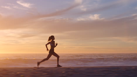 fit and active jogger running by the ocean