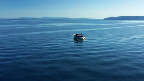 motorboat isolated on scenic blue ocean of adriatic sea near moscenicka draga, croatia