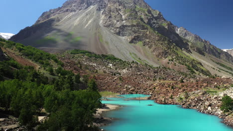 Cinematic-drone-shot-revealing-the-mountains-at-Naltar-Valley-in-Pakistan,-aerial-shot