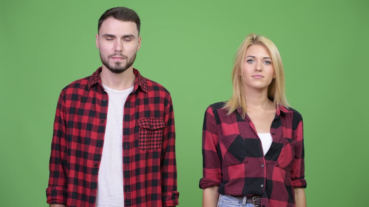 Young couple giving handshake together