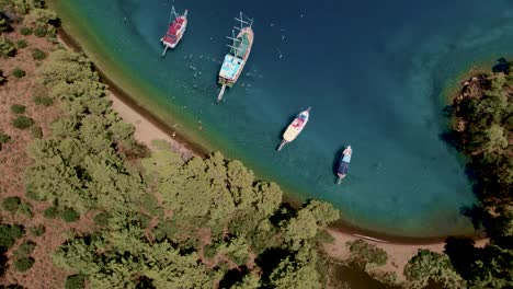 Top-down-view-of-the-vintage-boats-and-yachts-docked-at-the-sea-shore