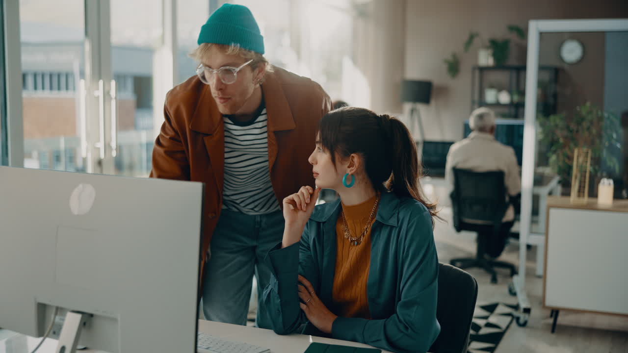 Two Coworkers Collaborating in an Office Setting