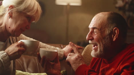 elderly couple enjoying coffee together