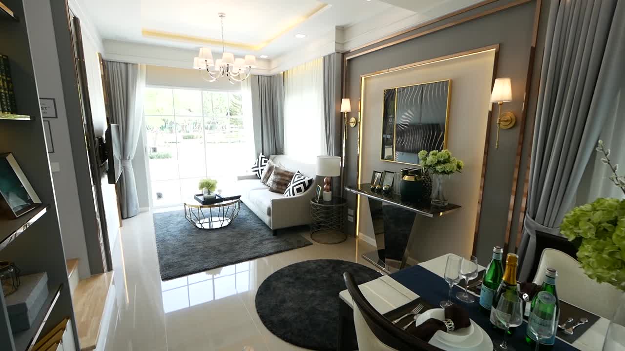 elegante recorrido de decoración del hogar de planta abierta desde la sala de estar hasta el comedor