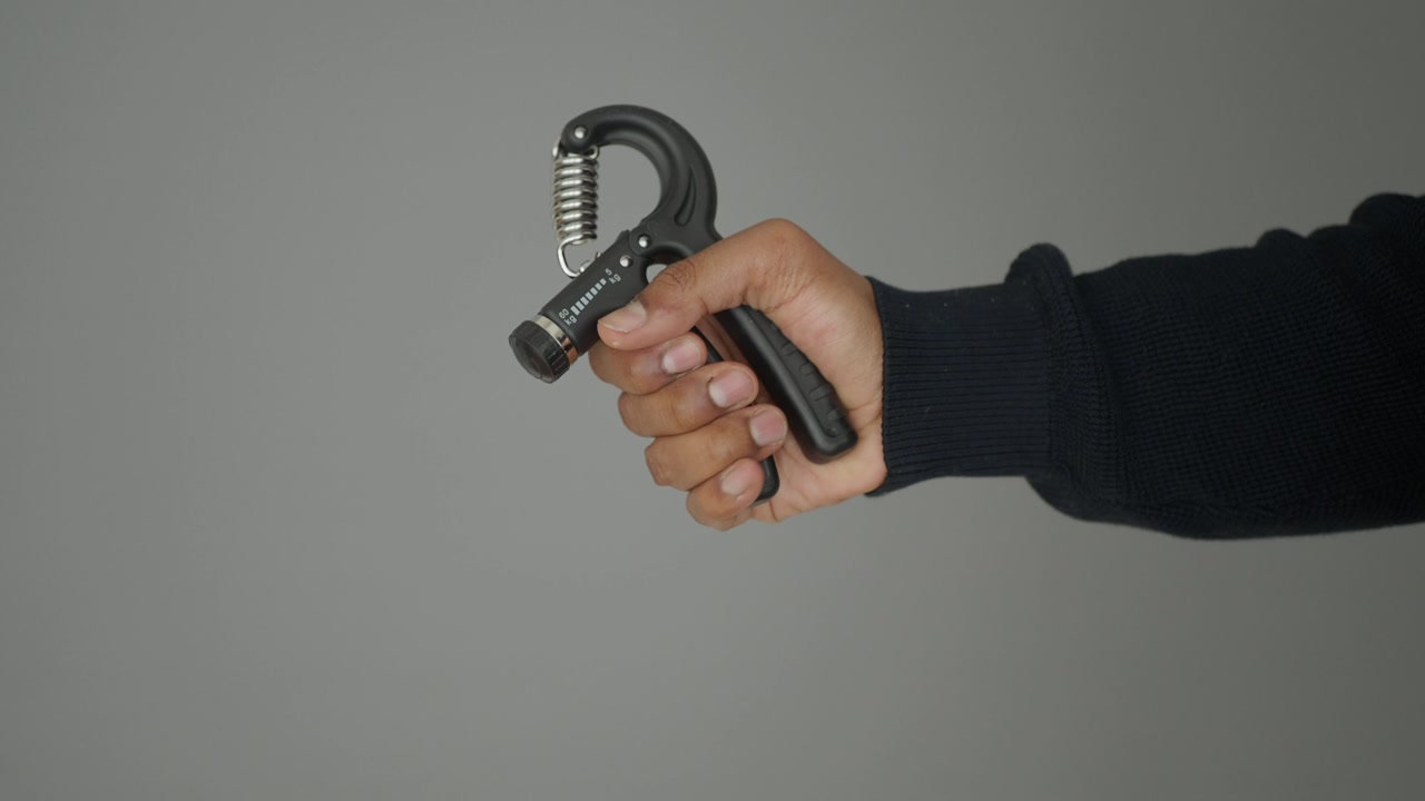 Close-up of Hand Exercising with a Grip Strengthener