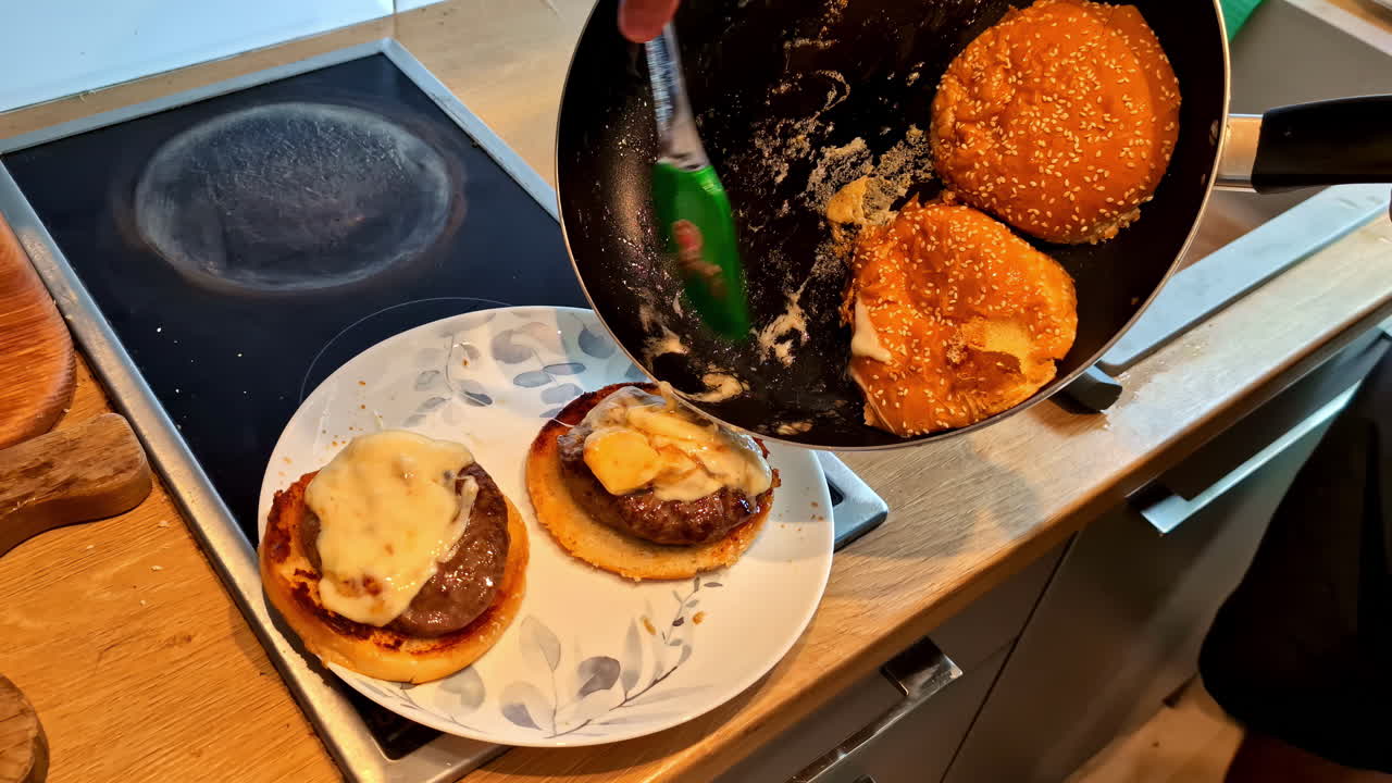 Burger preparation on process by a chef.