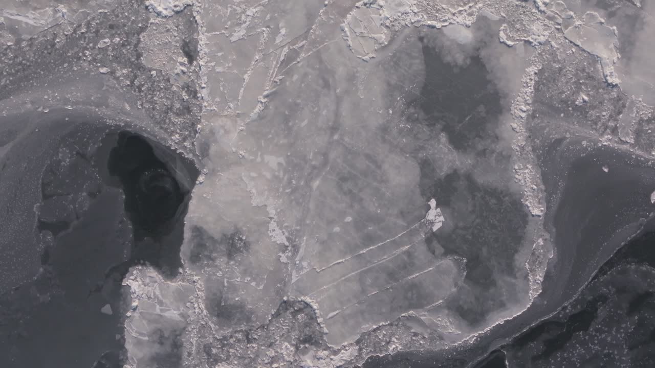 Aerial view of the frozen waters along the edges of the Hudson River in New York.