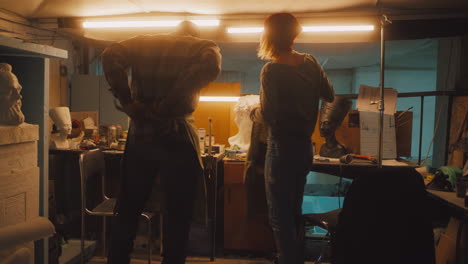 artists preparing for work in a sculpture studio