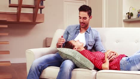 young couple relaxing on sofa