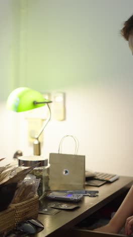 man standing at retail counter