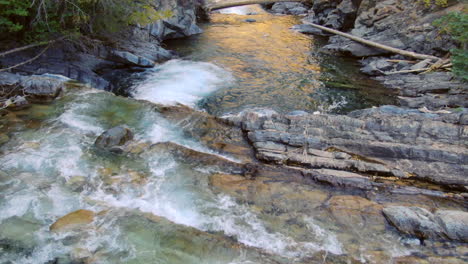 Marble-Crystal-Mill-Colorado-scenic-aerial-drone-cinematic-fall-autumn-Southern-Colorados-late-afternoon-sunset-cloudy-shaded-down-the-river-fallen-tree-landscape-pan-reveal-forward-movement