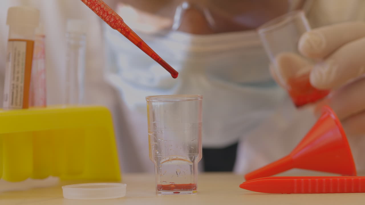 Red specimen in a sample tube. Clinical research concept in a lab