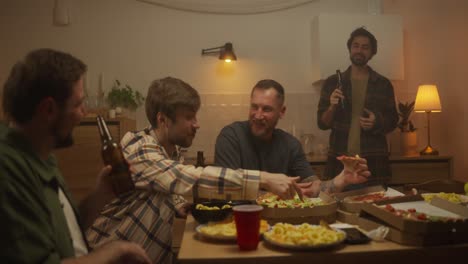 friends enjoying pizza and drinks at home