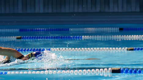 female swimmer swimming inside pool 4k