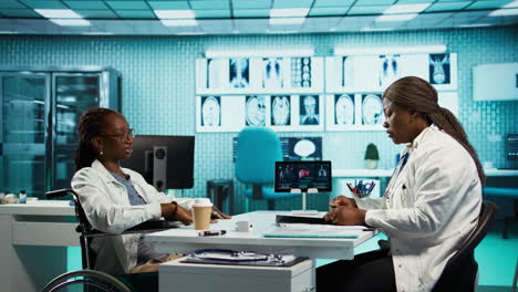 medical interaction between a doctor and a patient in wheelchair