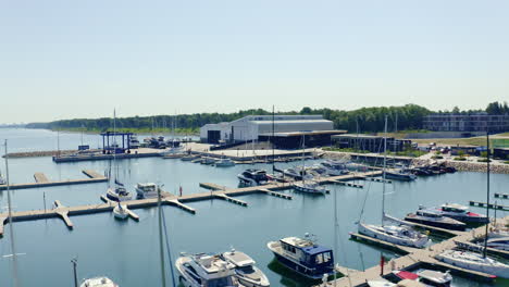 Aerial-circulating-view-of-docked-sailboats-and-motorboats-at-the-yacht-club