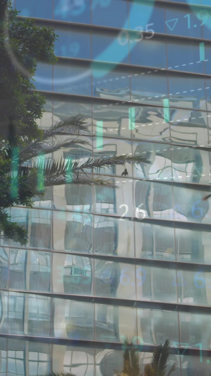 Animation of statistical and stock market data processing against tall buildings