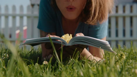 woman reading a book in a garden